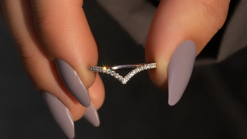 curved moissanite wedding band