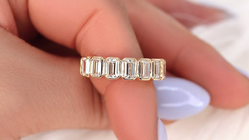 moissanite emerald cut eternity band