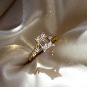 The Side Stone Elara Emerald Moissanite Ring - KNT - Engagement Rings, Wedding Bands & Fine Jewelry
