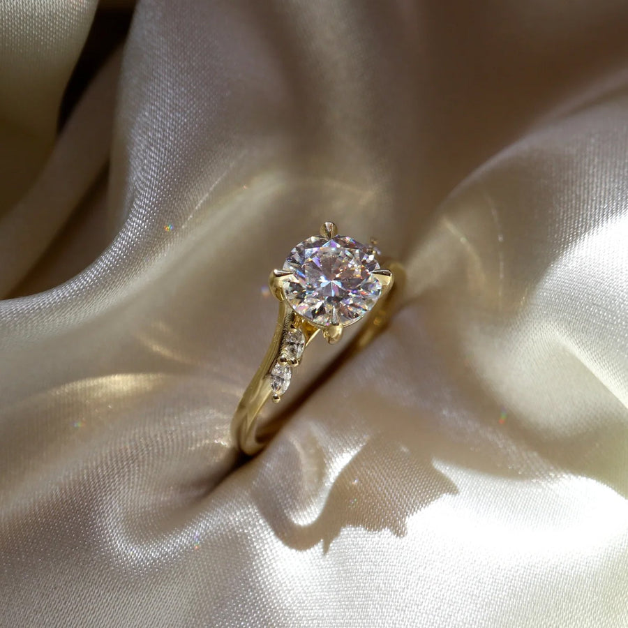 The Side Stone Elara Round Moissanite Ring - KNT - Engagement Rings, Wedding Bands & Fine Jewelry