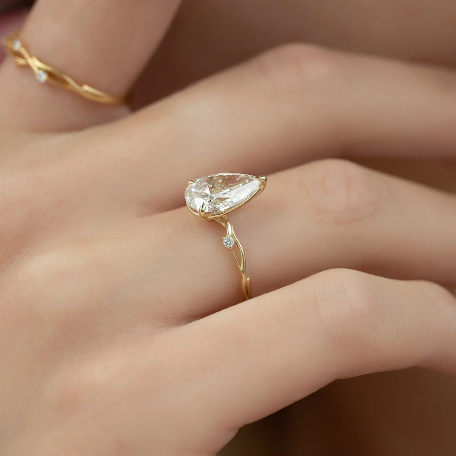 The Coco Pear Side Stone Moissanite Ring - KNT - Engagement Rings, Wedding Bands & Fine Jewelry