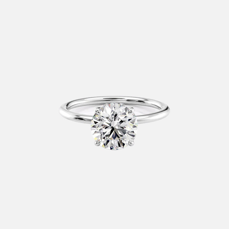  The Solitaire Crown Kamellie Round Moissanite Ring 18k White Gold 001