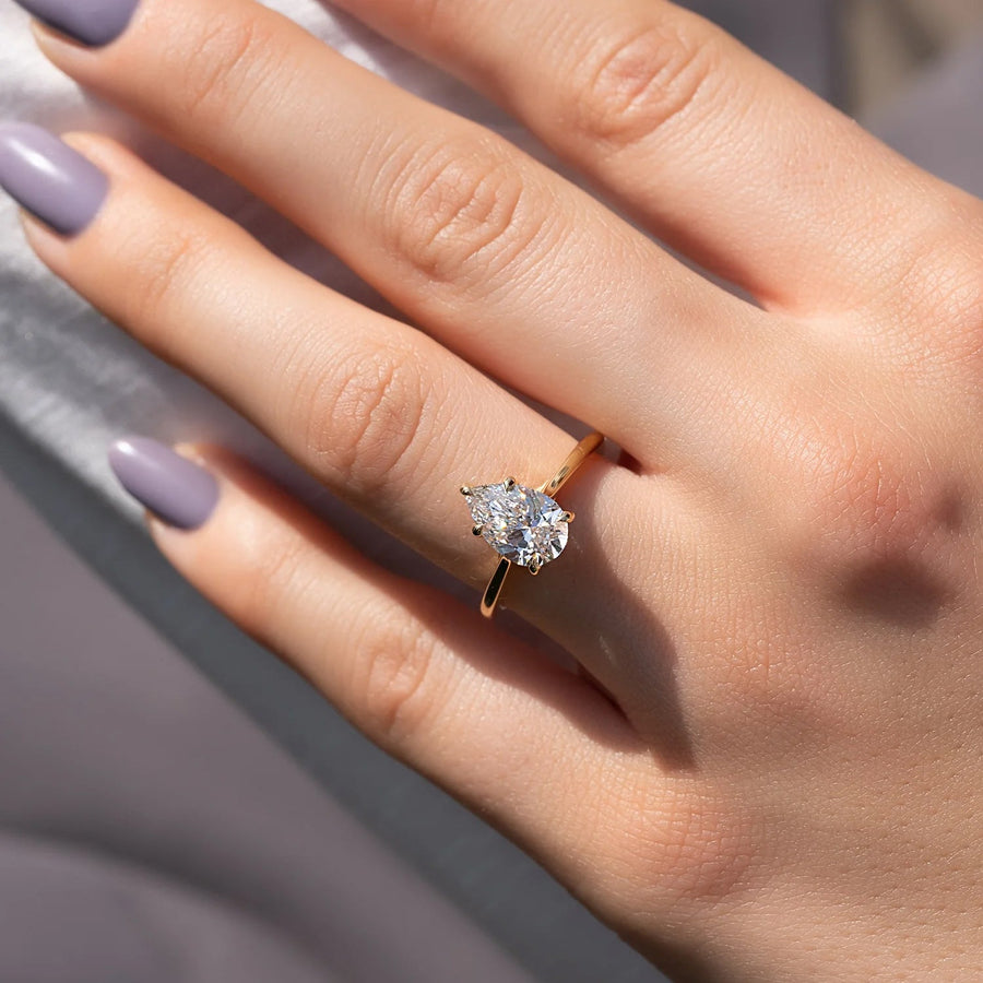  The Solitaire Lexie Pear Moissanite Ring 18k Yellow Gold 003