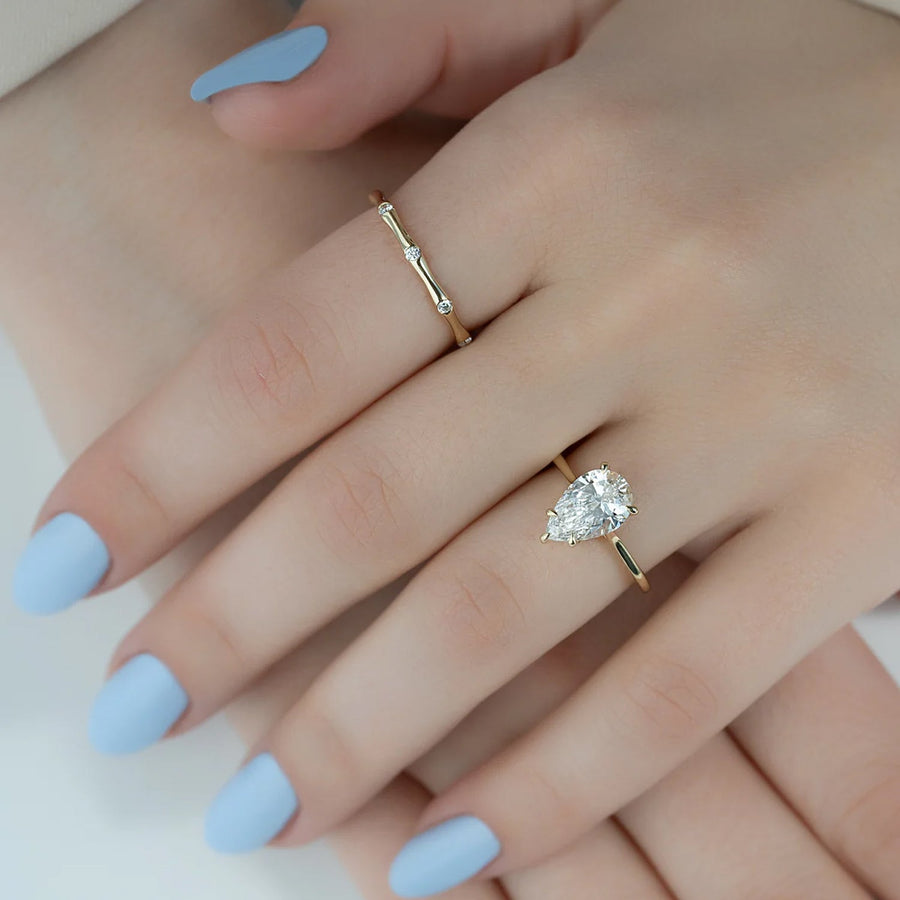  The Solitaire Lexie Pear Moissanite Ring 18k Yellow Gold 004