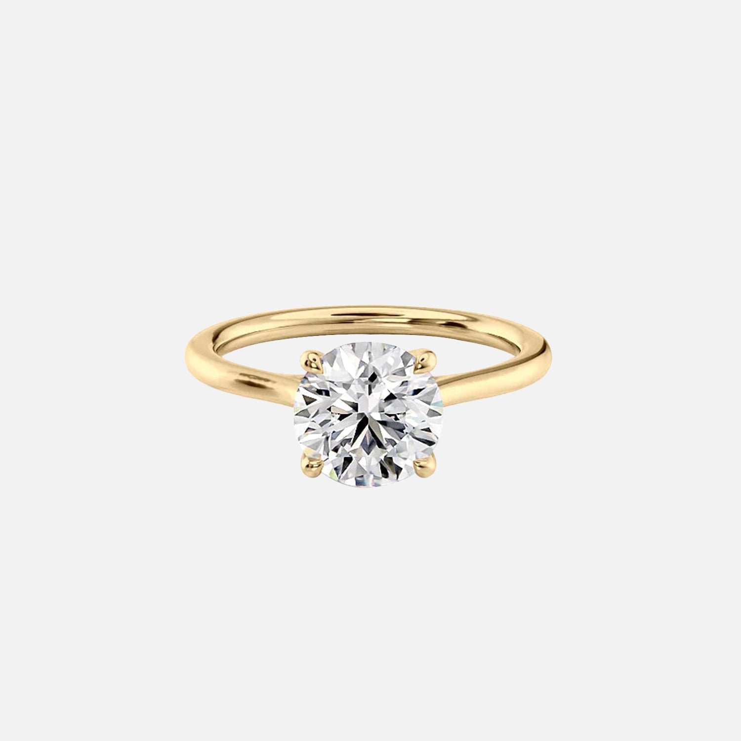 The Solitaire Lexie Round Moissanite Ring 14k Yellow Gold 001
