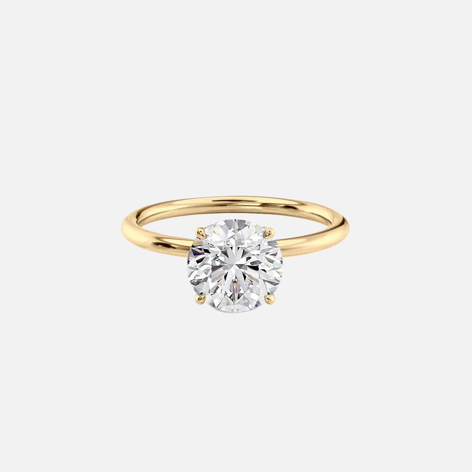 The Solitaire Lily Round Moissanite Ring 14k Yellow Gold 001