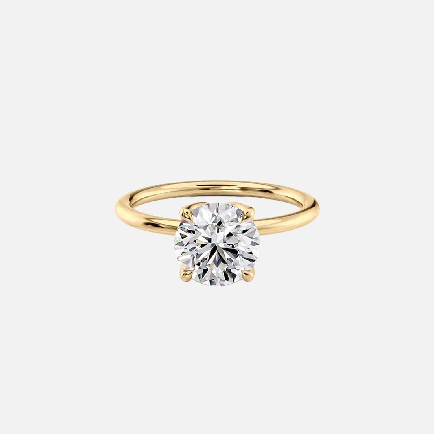 The Solitaire Lisa Round Moissanite Ring 14k Yellow Gold 001