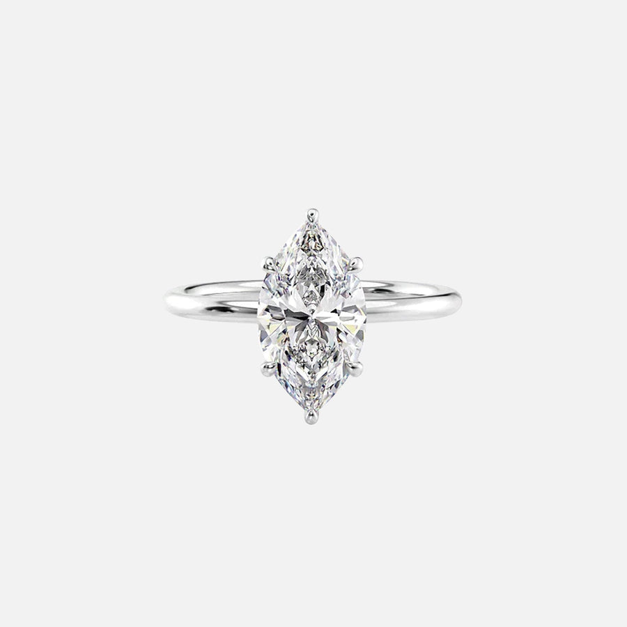  The Solitaire Low Profile Kamellie Marquise Moissanite Ring 18k White Gold 001
