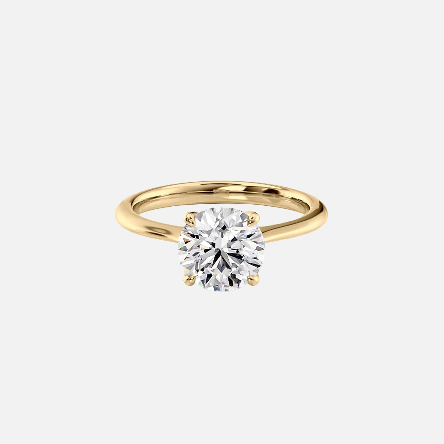 The Solitaire Madison Round Moissanite Ring 14k Yellow Gold 001