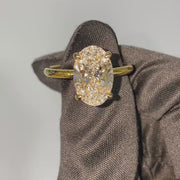 The Solitaire Low Profile Kamellie Oval Moissanite Ring